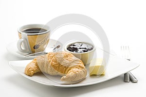 Continental breakfast of coffee and croissants