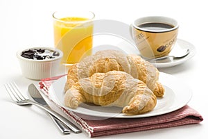 Continental breakfast of coffee and croissants