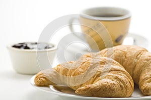 Continental breakfast of coffee and croissants