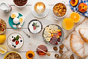 Continental breakfast menu on woden table