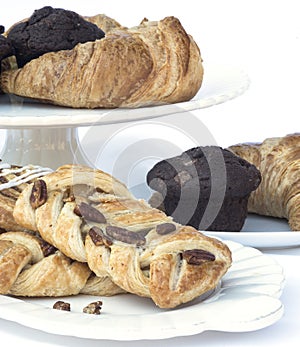 Continental breakfast table setting with pastries and cakes