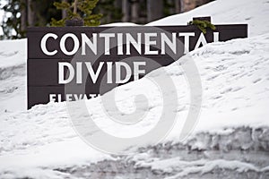 Continental divide sign on mountain in snow - Yellowstone Nation