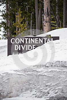 Continental divide sign on mountain in snow - Yellowstone Nation