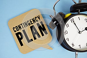 Contingency Plan text with alarm clock on blue background
