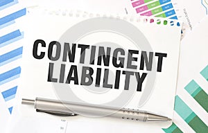 CONTINGENT LIABILITY on white paper sheet on charts photo