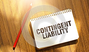 CONTINGENT LIABILITY words on notebook with red pencil photo
