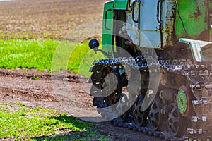 Continuous caterpillar tracks of the bulldozer. Close up detail of a metall crawler tractor tracks