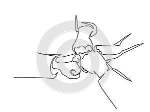 Continuous line drawing of hands of team bumping fists together