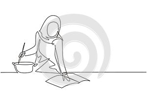 Continuous one line drawing beautiful Arabian woman cooking meal while reading tutorial book on cozy kitchen table at home.