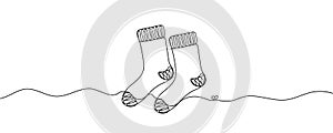 Continuous one line drawing of a Christmas stocking. Christmas sock on a white background. Vector illustration