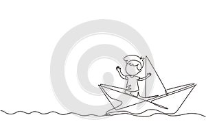 Continuous one line drawing cute smiling little boy sailing on paper boat. Happy smiling kid having fun and playing sailor in