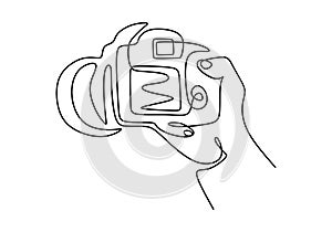 Continuous one line drawing of finger holding digital single-lens reflex camera for professional photographer and videographer.