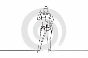 Continuous one line drawing handywoman stands with thumbs-up gesture and tools such as pliers, screwdriver, hammer that is placed