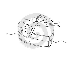 Continuous one line drawing of present box shapped love/ heart. Presents cardboard box with ribbon single line art vector design.