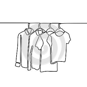 Continuous one line drawing of sweater, shirt, and t-shirt hanging on clothing rack. Minimalistic style of fashionable wardrobe photo