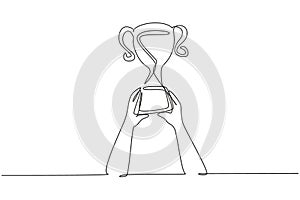 Continuous one line drawing trophy is held by both hands. Symbol of winning championships, matches and sports competitions. Best