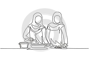 Continuous one line drawing two Arabian woman pouring cooking oil from bottle into frying pan on stove. Prepare food in kitchen.