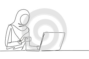 Continuous one line drawing young Arab woman typing entering credit card code on laptop around desk. Digital lifestyle, e-commerce