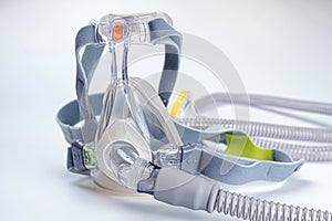 Continuous positive airway pressure- mask (CPAP) and hose isolated on white background