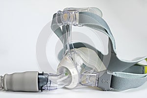 Continuous positive airway pressure- mask (CPAP) and hose isolated on white background