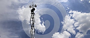 Contour small military radar station on background beautiful clouds and sky. Mobile relay station, Russia