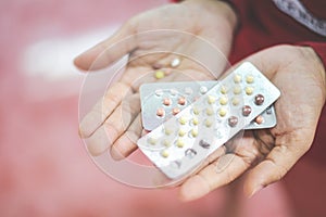 Contraception pills in hand woman holding - Birth control contraceptive means prevent pregnancy