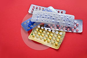 Contraceptive pill Prevent Pregnancy Contraception concept Birth Control on red background