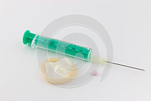 Contraceptives - syringe, condom, pill photo