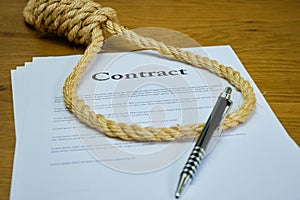 Contract with pen and rope tied in hangmans noose. Strangulation contract, unfair agreement. Lorum Ipsum text