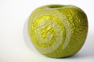 Contracted green dry apple