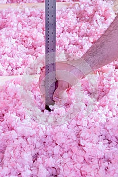 Contractor checking the insulation in a home