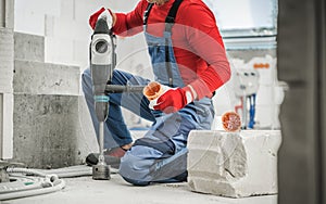 Contractor Electrician Worker Drilling Electric Outlets Holes