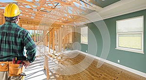 Contractor Facing Before and After Interior of House Wood Construction Framing and Finished Build