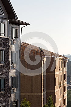 Contractor framing roof on new apartment building