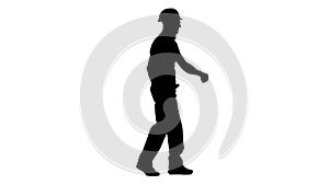 Contractor goes to the object with a helmet and tools. White background. Silhouette. Side view