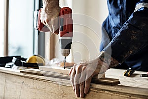 Contractor handyman working and using screwdriver