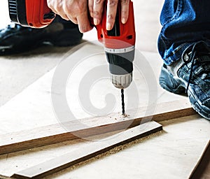 Contractor handyman working and using screwdriver