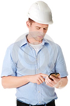 Contractor in hardhat using his cell phone