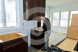 Contractor installing a laminate counter top during a kitchen remodel