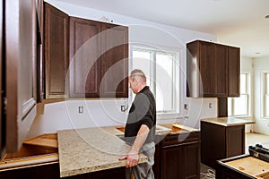 Contractor installing a new laminate kitchen counter top