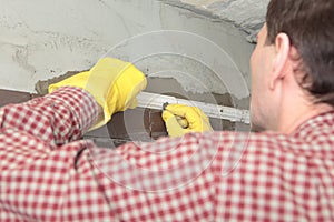 Contractor installing tiles