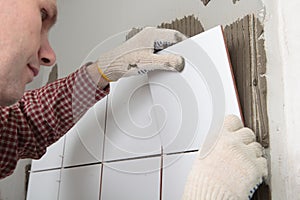 Contractor installing tiles