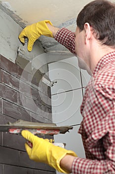 Contractor installing tiles