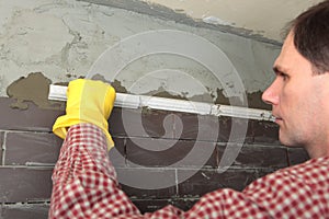 Contractor installing tiles