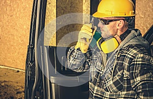 Contractor Making Quick on Site Conversation Using Walkie Talkie