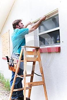 Contractor Measures Window