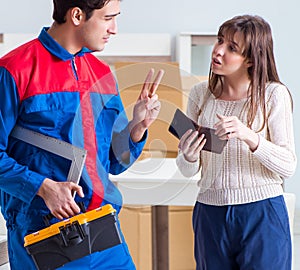 Contractor repairman assembling furniture under woman supervisio