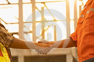 The contractor and the supervisor shook hands after inspecting the site