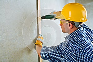 A contractor working with electrical screwdriwer