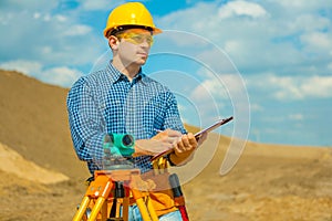 A contractor writing in clipboard